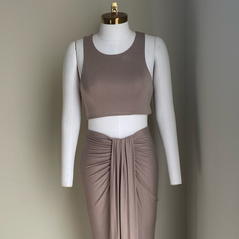 New in pack two piece skirt set. Size small medium and large available.
